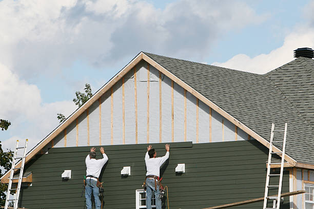 Professional Siding Installation technician working in Utica, NY